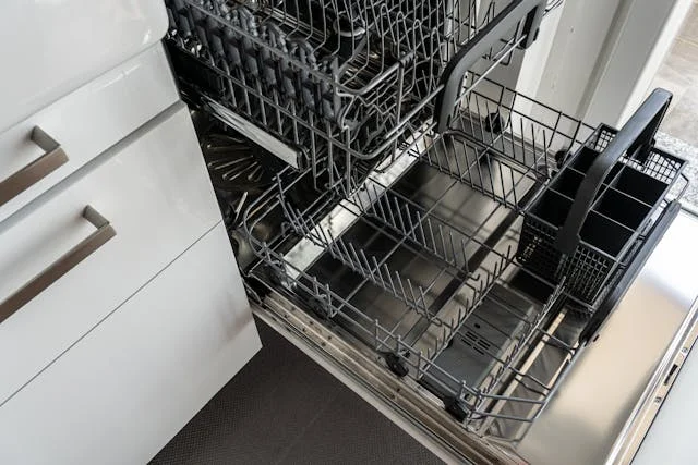 dishwasher repair service technician working