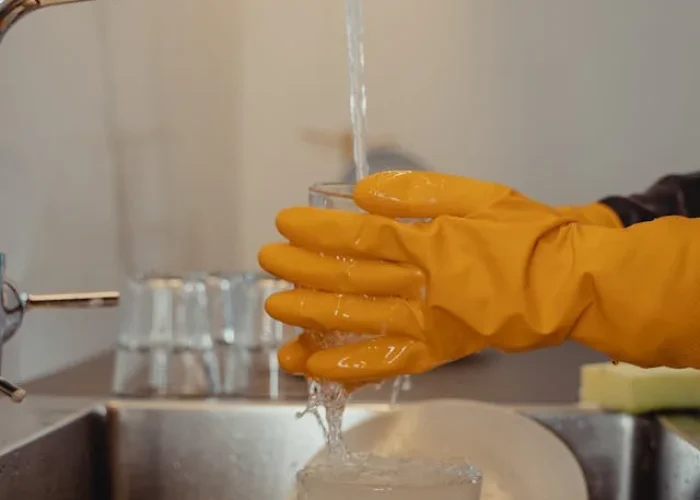 dishwasher repair service technician working