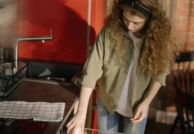 dishwasher repair service technician working