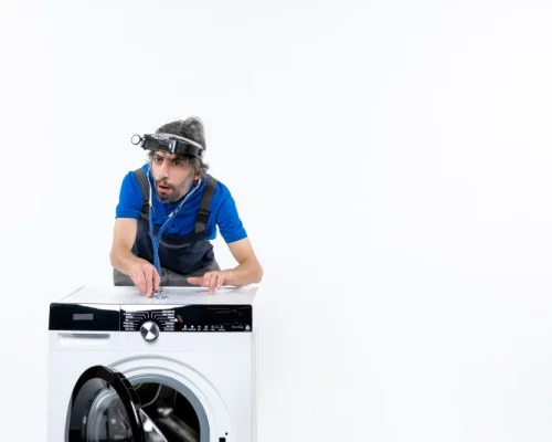 appliance repair expert working on dryer
