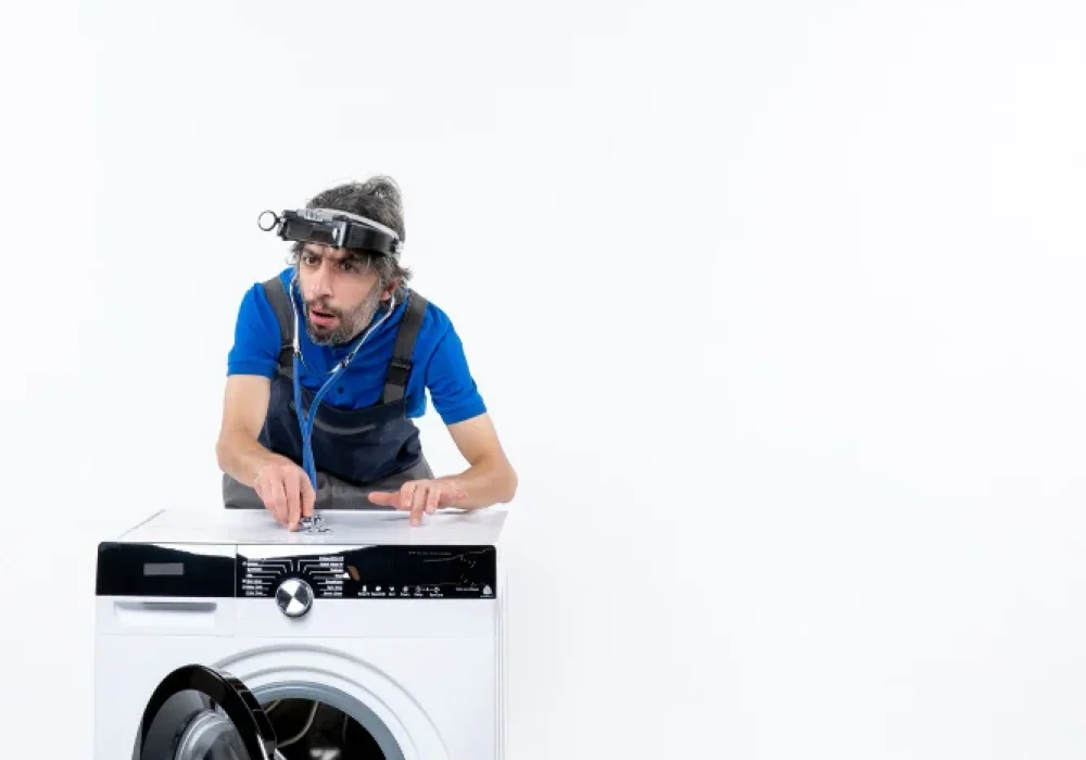 appliance repair expert working on dryer