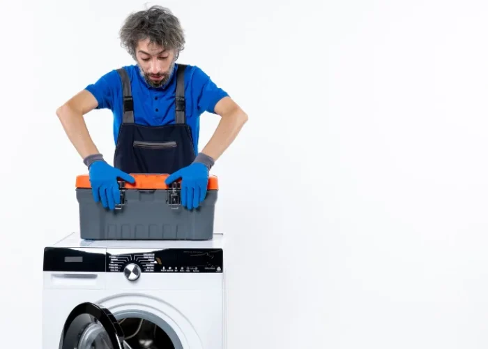 appliance repair expert working on dryer
