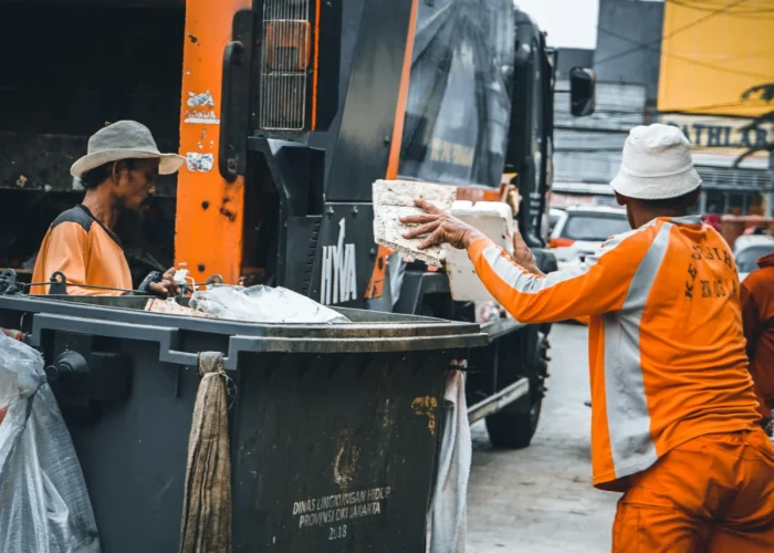 Garbage disposal repair service technician repairing kitchen sink disposal in Naperville Illinois