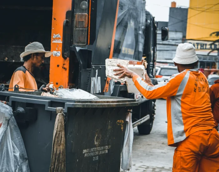 Garbage disposal repair service technician repairing kitchen sink disposal in Naperville Illinois