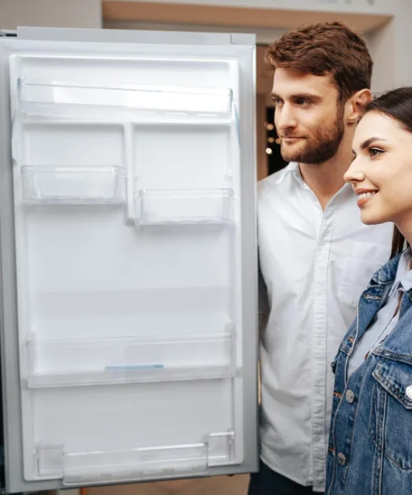 technician checking refrigerator compressor issue