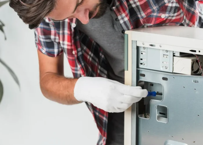 technician checking refrigerator compressor issue